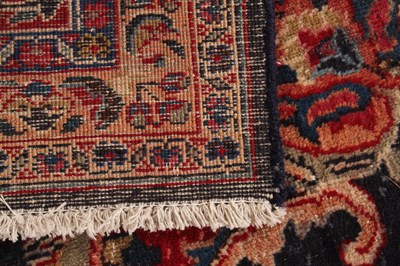 Lot 14 - A large Persian Tabriz woollen rug, the...