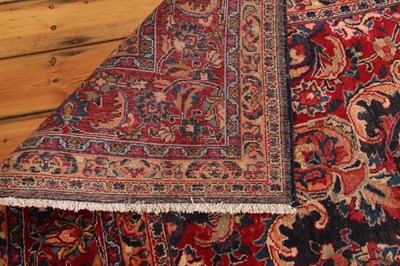 Lot 14 - A large Persian Tabriz woollen rug, the...