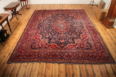 Lot 14 - A large Persian Tabriz woollen rug, the...
