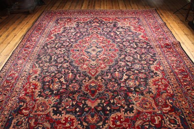 Lot 14 - A large Persian Tabriz woollen rug, the...