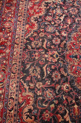 Lot 14 - A large Persian Tabriz woollen rug, the...