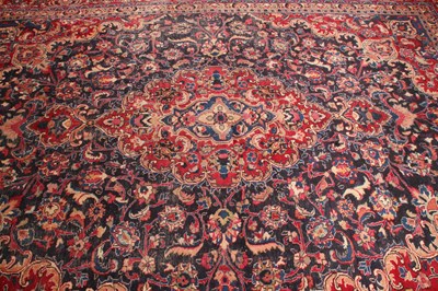Lot 14 - A large Persian Tabriz woollen rug, the...
