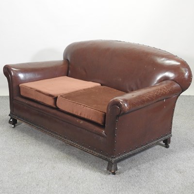 Lot 79 - A 1920's brown upholstered sofa