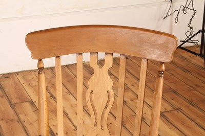 Lot 48 - A beech farmhouse rocking chair, 20th century,...
