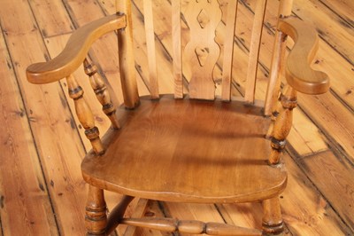 Lot 48 - A beech farmhouse rocking chair, 20th century,...