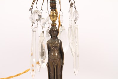 Lot 60 - A figural table lamp, having glass droplets...