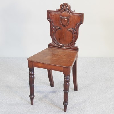Lot 115 - A Victorian carved mahogany hall chair, with a...