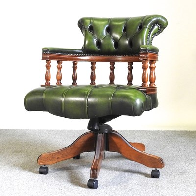 Lot 290 - A green leather upholstered swivel desk chair