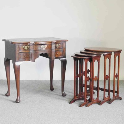 Lot 151 - A continental walnut lowboy, of serpentine...
