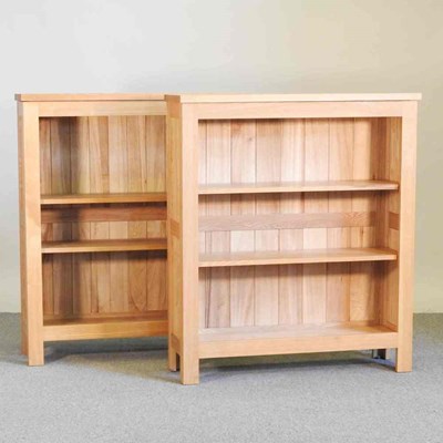 Lot 119 - A modern light oak dwarf bookcase, together...