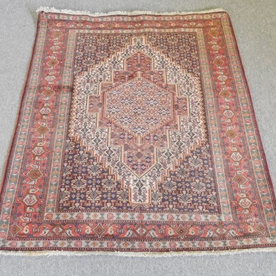Lot 137 - A Persian Senneh rug, with a stepped central...