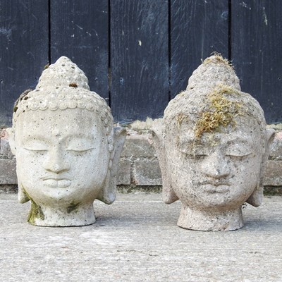 Lot 76 - A cast stone Buddha head, 35cm high, together...