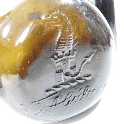 Lot 45 - A 19th century brown glass wine bottle,...