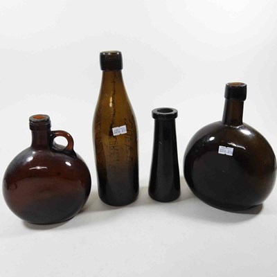 Lot 45 - A 19th century brown glass wine bottle,...