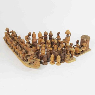 Lot 88 - A carved wooden model of a dug out primitive...