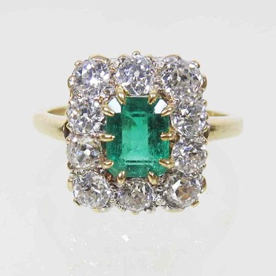 Lot 48 - An impressive emerald and diamond cluster ring,...