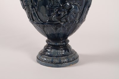 Lot 19 - A large blue glazed majolica urn, 19th century,...