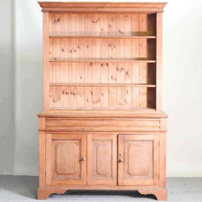 Lot 123 - An antique pine dresser, with open shelves and...