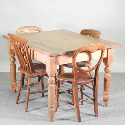 Lot 129 - An antique pine dining table, together with...