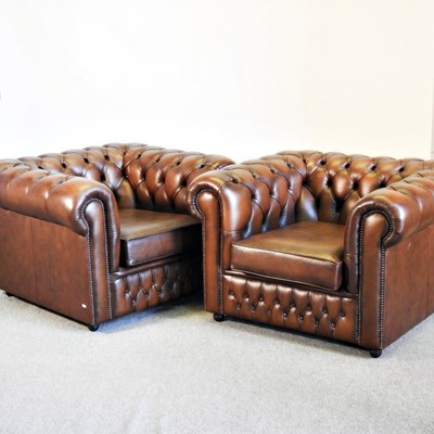 Lot 84 - A pair of brown leather upholstered...
