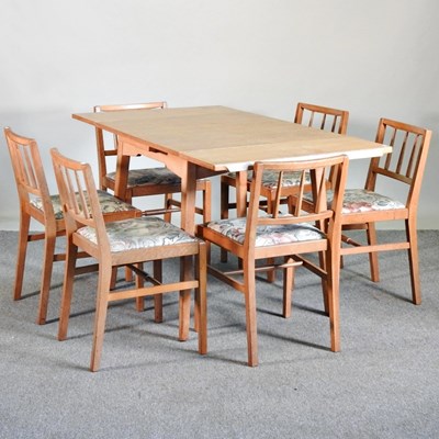 Lot 303 - A 1970's G Plan draw leaf dining table,...