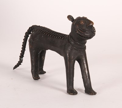 Lot 57 - A bronze model of a lion, possibly Benin,...