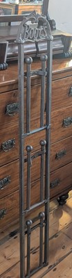 Lot 267 - A metal wall mounted boot rack, h.150cm, w.27cm