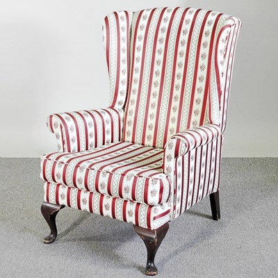 Lot 370 - A mid 20th century striped upholstered wing...