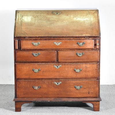 Lot 64 - A George III mahogany bureau, on bracket feet