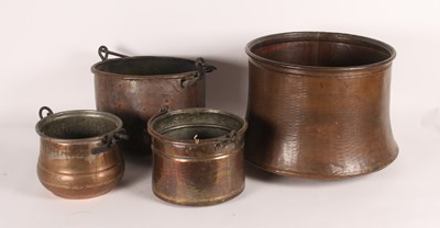 Lot 54 - Four copper cauldrons, varying sizes, largest...