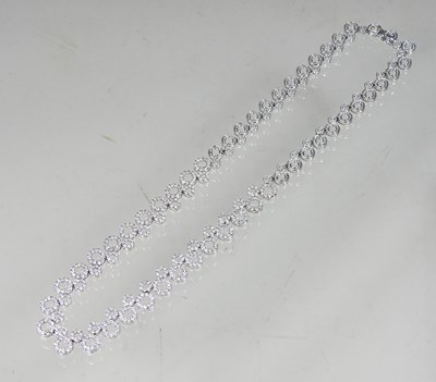 Lot 58 - An 18 carat white gold and diamond set...