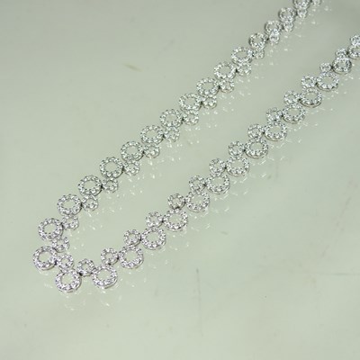Lot 58 - An 18 carat white gold and diamond set...