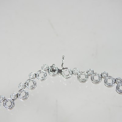 Lot 58 - An 18 carat white gold and diamond set...