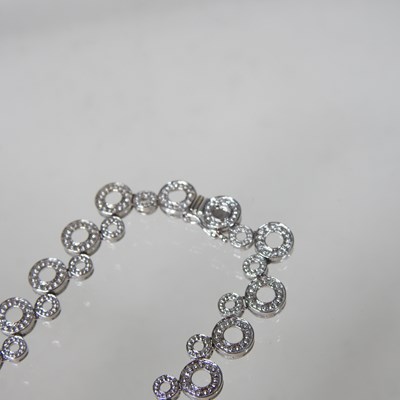 Lot 58 - An 18 carat white gold and diamond set...