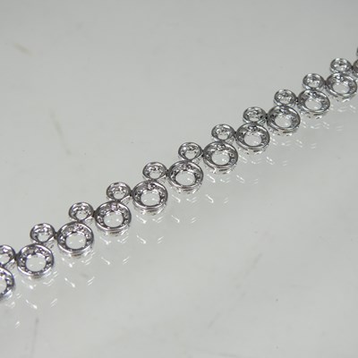 Lot 58 - An 18 carat white gold and diamond set...