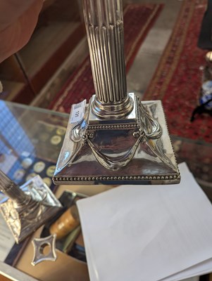 Lot 131 - A pair of George III silver candlesticks, each...