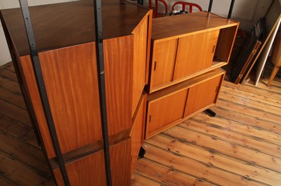 Lot 64 - A Ladderax teak corner unit, 1970s, having...