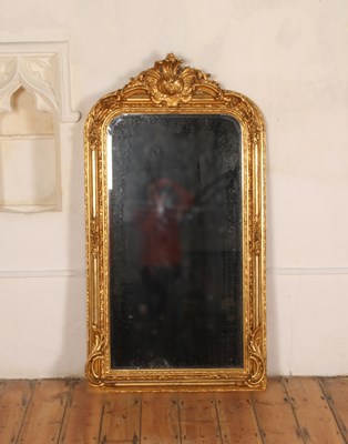 Lot 319 - A large gilt framed wall mirror, decorated...