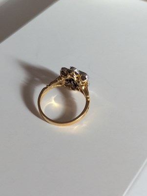 Lot 113 - An 18ct yellow gold blue and yellow sapphire...