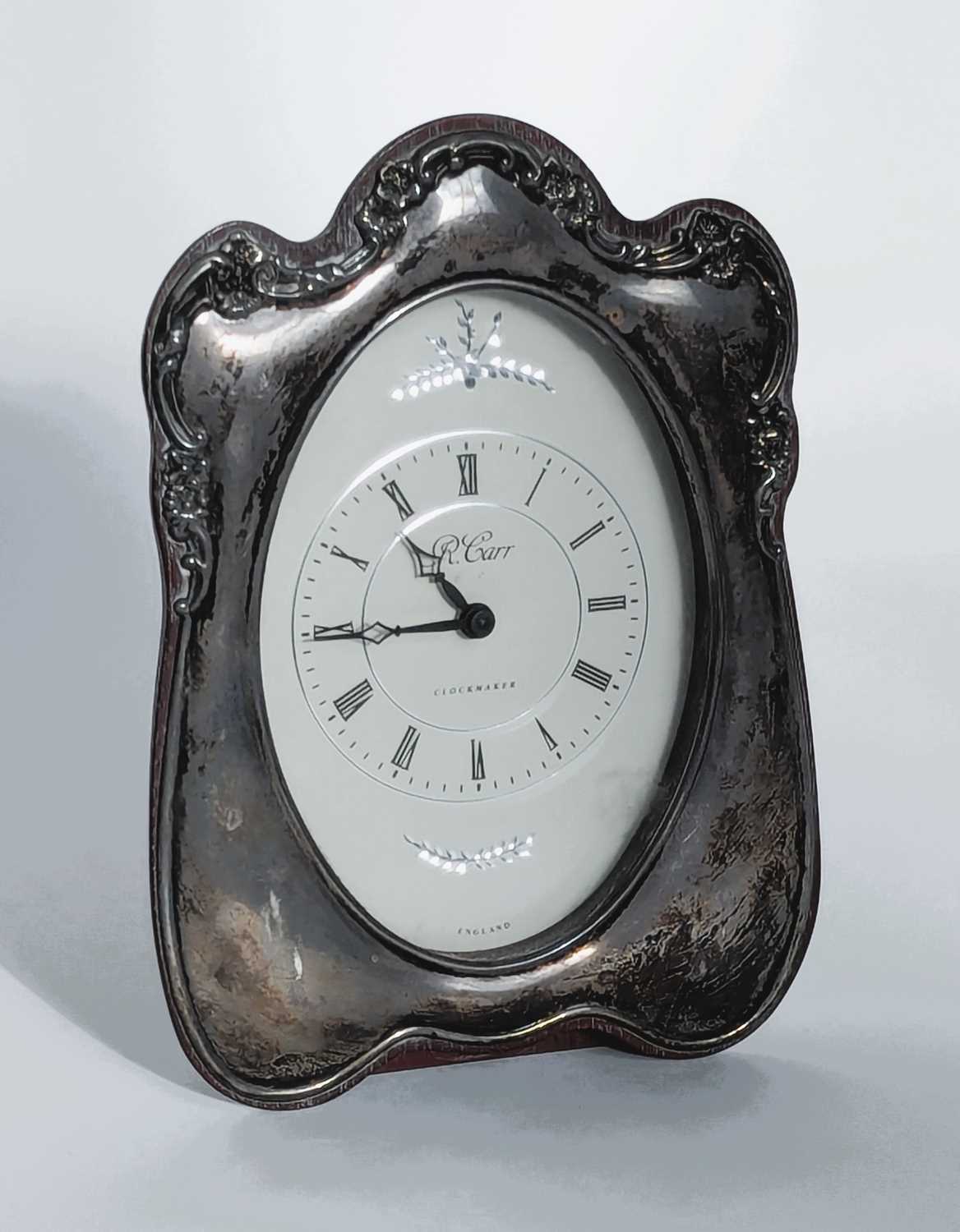 Lot 138 - A Carr silver clad mantel clock