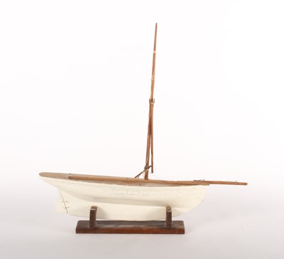 Lot 217 - A vintage carved pine pond yacht, length 67cm
