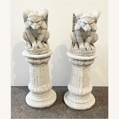 Lot 404 - A pair of reconstituted stone garden statues...
