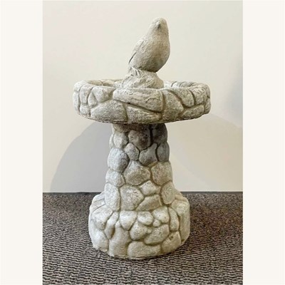 Lot 312 - A cast stone bird bath, 57cm high