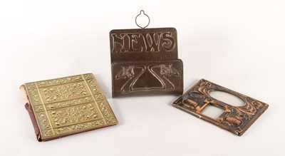 Lot 82 - An Art Nouveau copper wall mounted newspaper...
