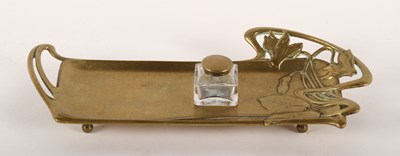 Lot 109 - An Art Nouveau brass desk stand, decorated...