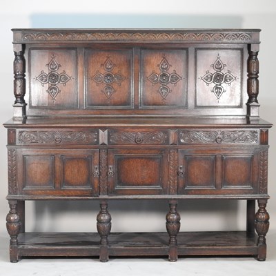 Lot 494 - An early 20th century carved oak sideboard, of...