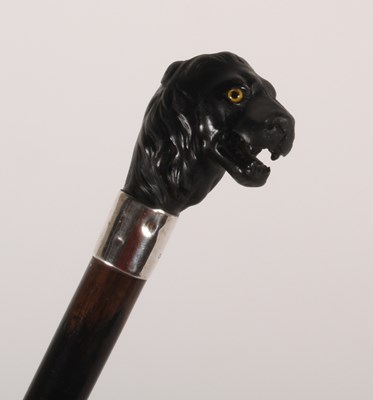 Lot 319 - A walking stick, having a carved lion's head...