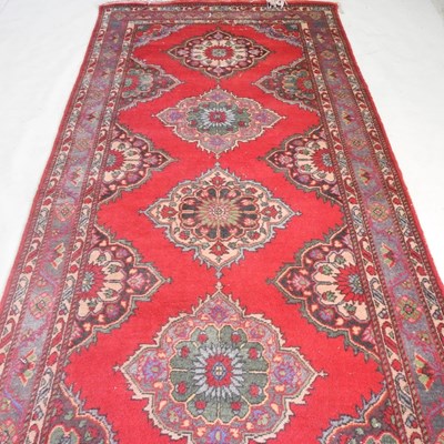Lot 489 - A Persian woollen carpet, 400 x 150cm, with a...