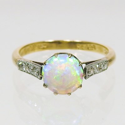 Lot 247 - An 18 carat gold opal and diamond ring, with...