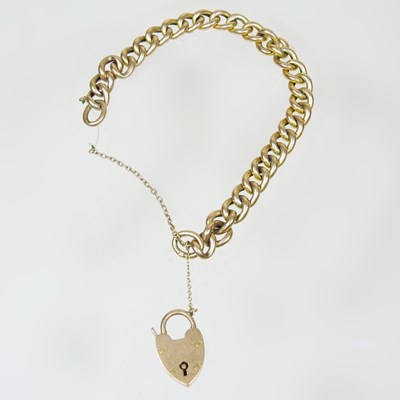 Lot 63 - A 9 carat gold curb link bracelet, with a 9...
